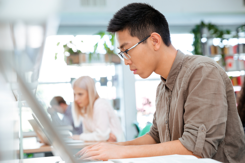 Portrait of a students studying in the library